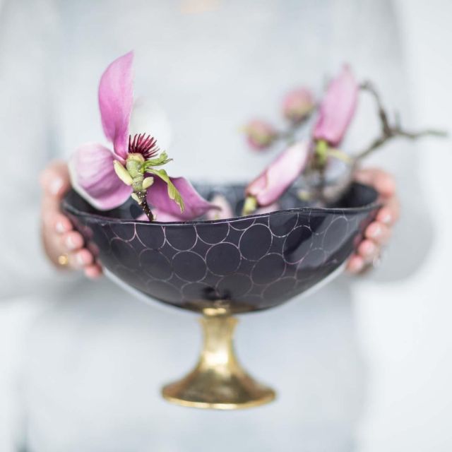 anna tableware designer, Zenia is a medium sized fruit bowl with an irregular form rim in deep night blue with our flirty Sixties pattern on a bronze pedestal