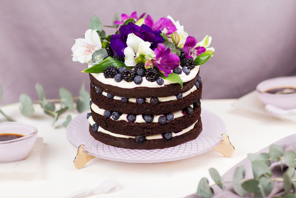 Coffee Cake desserts presentation Dicra is gorgeous, flushed in soft shell pink and adorned with our royal Venetian Filigree design. Dicra has a beautiful cake on top with fresh pink and purple flowers