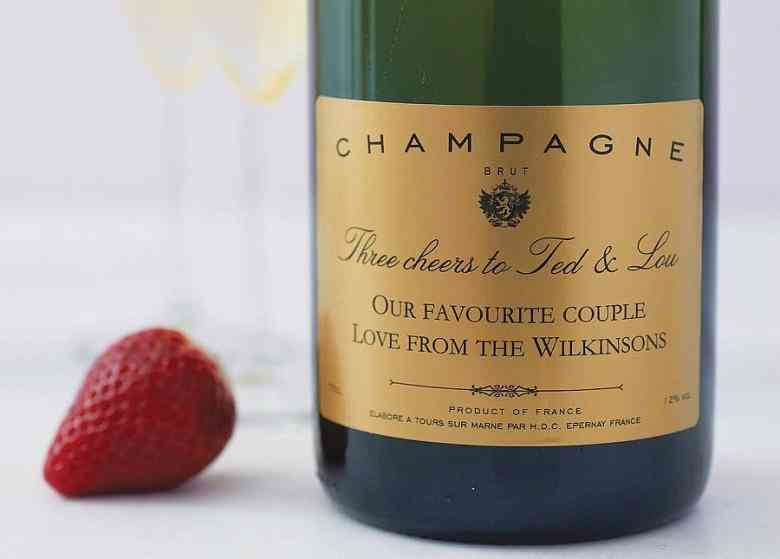 Customized champagne bottle with the names of the couple getting married