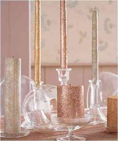 Glittery candles with different hights used to enlighten the Christmas spirit