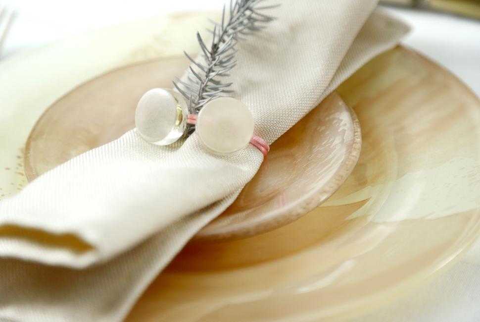 Graci is a napkin holder with two round turtledove cream coloured glass gems, tied with a velvet ribbon.