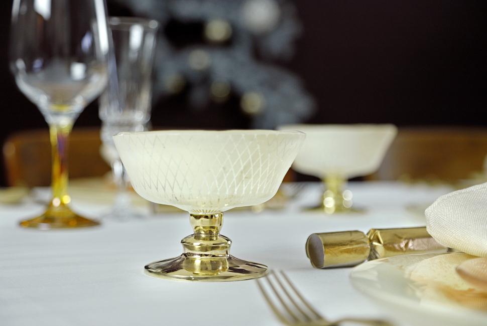 Mardy is a sweet, cream coloured ice cream bowl adorned with our lattice Venetian Filigree pattern on a stem.