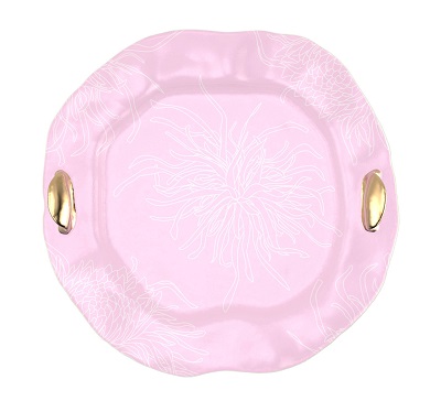 Pheni on white background. Pheni is a magnificent serving tray in soft shell pink with our minimal Perky Chrysanthemum pattern with bronze handles.