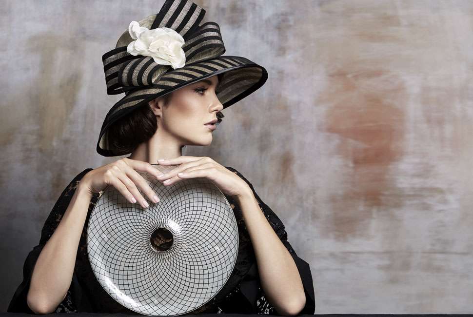 Beautiful lady dressed in the style of the Spring racing events in Melbourne Australia is presenting Lois dinner plate. The lady is with stylish black hat. Presentation is the next consideration and the Polly sushi platter, with its delicious cream colour, softly raised rim and our own lattice Venetian Filigree pattern is perfect.