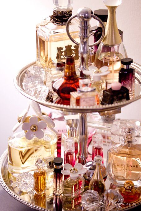 2 tier cake stand covered in perfumes