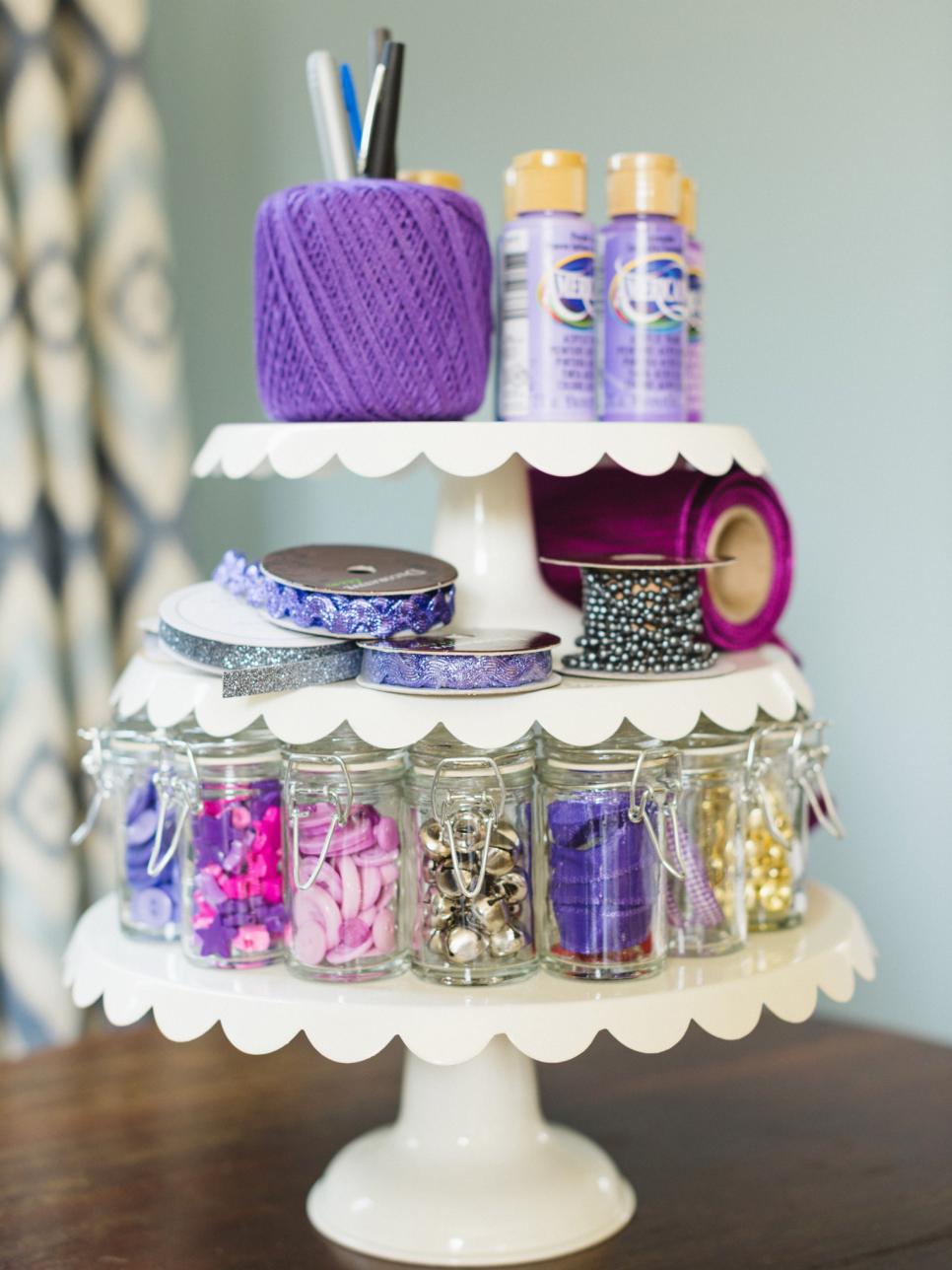 3 tier cake stand covered in wool, jars or glitter and other arts and crafts materials 