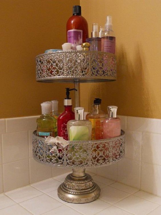 2 tier cake stand covered in lotions, shampoos and other cosmetics