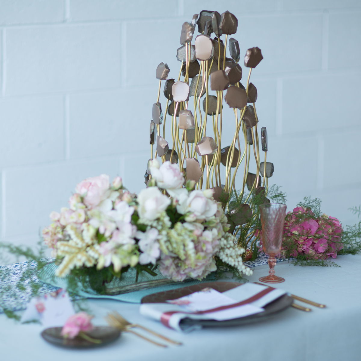 wedding ideas - unique centrepiece on table setting with deisgner tableware and pastel flowers 
