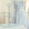 Blue High Tea Stand, Sym 2-Tier Cake Stand by Anna Vasily with a Blue Dress in the Background